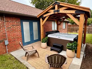 Image of NEW Hot Tub, King Bed, Arcade, 65” TV, Fast WIFI, Long Term Stays Available