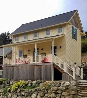Image of Charming, three-story getaway w\/ two cozy living areas - walk to the beach
