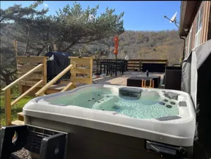 Image of Breathtaking views. Hot tub. Private pond. Huge deck. Fast wifi.