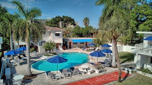 Image of 1 bedroom w king bed.  Overlooks Pool from balcony