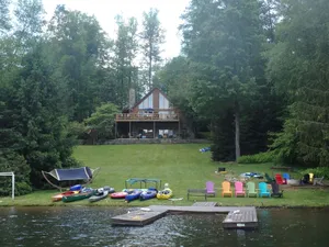 Image of Spacious Lakefront Log Home with large lakefront porch, firepit, kayaks\/canoes