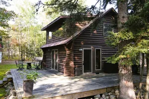 Image of Cozy Lakeside Log Cabin Perfect for Any Season
