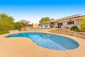 Image of Dog-friendly modern stay with a heated private pool, sun room, & grill