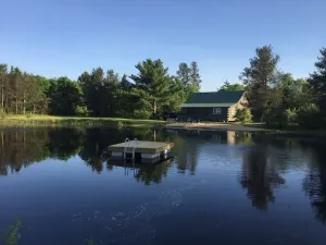 Image of Secluded family-friendly log cabin with swimming pond. Charm,  comfort.