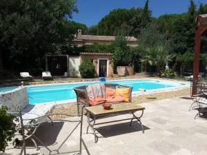 Image of Family home with pool in a green setting