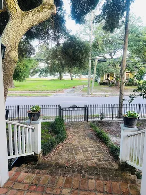 Image of After beach time come back to an outdoor soaking tub in privacy fenced back yard