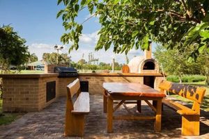 Image of Pizza oven; fire pit; lots of space indoor and outdoor, fires and aircon. Groups