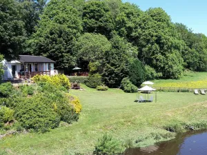 Image of This detached chalet perched above Douglas Water, boasts a picturesque private garden.