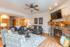 Image of Updated condo with peek-a-boo lake views, deck, W\/D, fireplace, & lake access