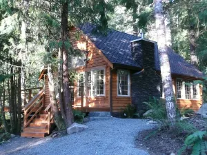 Image of Gorgeous secluded cabin 2 miles from Mt. Rainier National Park. Private hot tub overlooking Copper Creek. No other buildings in sight! Pet friendly. Children welcome. Two bedrooms, full kitchen, big deck with creek views.
