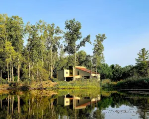 Image of Spacious contemporary home on 4 wooded acres and 200' of private lake front.