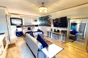 Image of Sleek & modern waterfront studio condo with two pools, gym, beach access & lanai