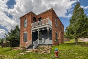 Image of Landmark home built in 1895 with porches, office & western-themed decor