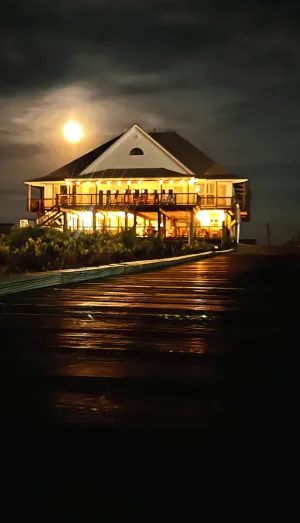 Image of Majestic bayfront home. 450’ pier w\/ boat access, crabbing, fishing, & swimming.