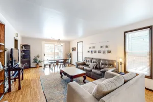 Image of Centrally located cottage with fenced backyard, hot tub, firepit, & grill