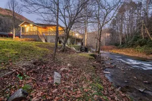 Image of Spacious Hideaway w\/ hot tub and creek- 1 mile from beautiful Watauga Lake