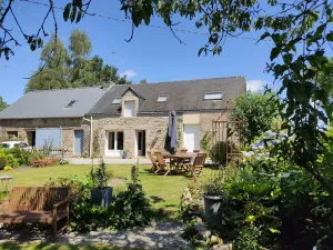 Image of Country house on the edge of a forest with landscaped garden.