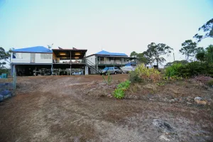 Image of Big inviting Queenslander overlooking the bay with sea breezes and water views