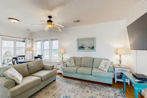 Image of Fun-filled vacation home steps from beach with outdoor pool, AC, W\/D, & balcony