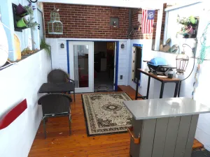 Image of PORTHOLE:  Peaceful with a private, locked, covered patio to relax\/ store bikes.