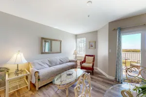Image of Convenient condo w\/ private balcony, beach views, shared pool & AC