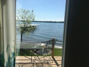 Image of Prime East Lake beachfront cabin with boat hoist in Okoboji