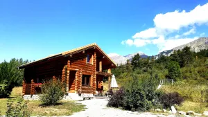 Image of Chalet in logs of raw wood in south's alps . quiet, space and comfort