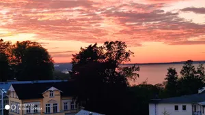 Image of Vacation apartment evening meal with sea view