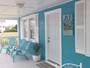 Image of This first floor unit\/second row home sits just across the street from a beach!