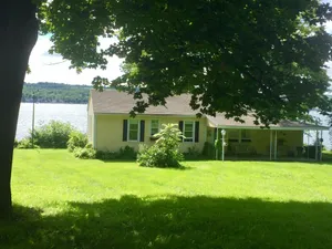 Image of QUINTESSENTIAL FINGER LAKES COTTAGE! CHARM ABOUNDS IN THIS COZY LAKEFRONT GEM!