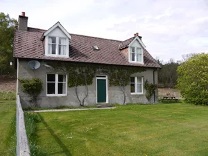 Image of Wisdomhowe is a traditional cottage, surrounded by a birch woodland.