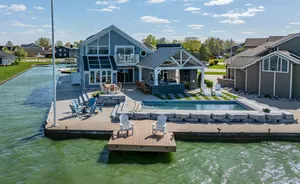 Image of Lake front 4-bedroom vacation home with pool and  tiki bar!