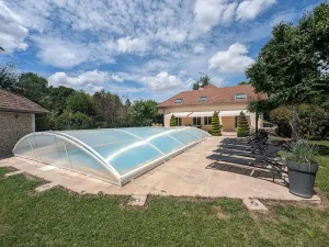 Image of Riverside Retreat: Cozy 3BR with Modern Kitchen, Garage & Village Charm