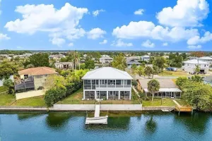 Image of Newly remodeled gulf canal home w\/floating dock and kayaks