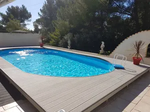 Image of pretty villa with swimming pool in a very quiet small housing estate.