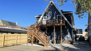 Image of 5 Minutes from Downtown Racine. Private deck, entrance, and driveway.