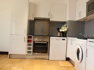 Image of 3-room apartment with equipped kitchen, TV, and hardwood floor in Rochefort