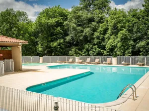 Image of Modern house on small holiday park with pool