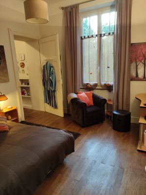 Image of Nice bedroom with dressing room in beautiful apartment