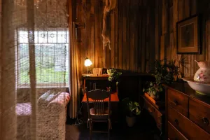 Image of Rustic cosy retreat, with library, fireplace, films and a Four Poster Bed.