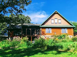 Image of Happy Days Log Home and garden on Fountain Lake. Toys for all!