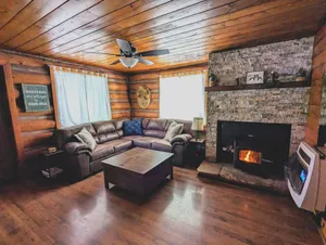 Image of Cozy Cub Log Cabin - Year Round Tranquil Beauty