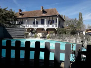 Image of Grand Gite des Trois Mousquetaires Swimming pools and reception room.