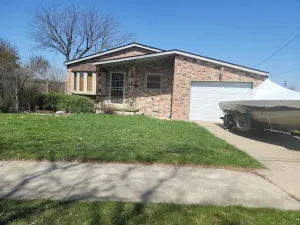 Image of Waterfront House with Boat Dock on Detroit River Channel. Fish from the backyard