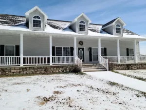 Image of A large country home with scenic views of a working cattle farm & rural locale.