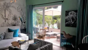Image of large studio with terrace facing pool, spa in the garden