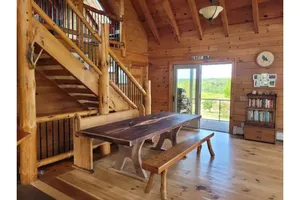 Image of Wild Wind Lodge with beautiful woodwork and views