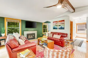 Image of Dog-Friendly Wooded Chalet w\/ Fast WiFi, a Private Hot Tub, & Furnished Decks