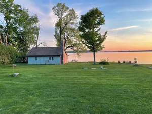 Image of Waterfront Log Cabin | Sunset Views, Fire Pit, Screened Porch