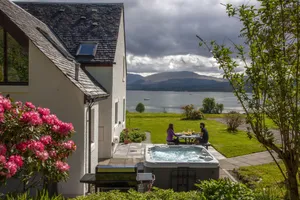 Image of Large cottage  on shore of Scottish Loch